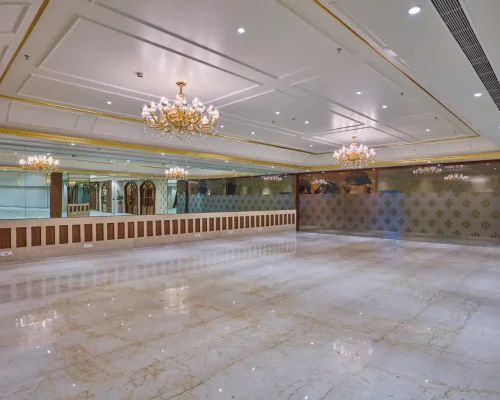 Spacious banquet hall in Vashi with marble flooring and chandeliers
